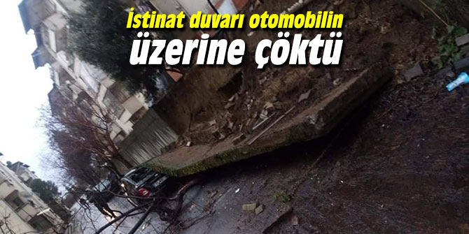 İstinat duvarı otomobilin üzerine çöktü
