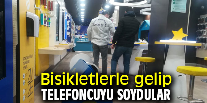Bisikletlerle gelip telefoncuyu soydular
