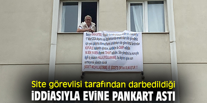 Site görevlisi tarafından darbedildiği iddiasıyla evine pankart astı
