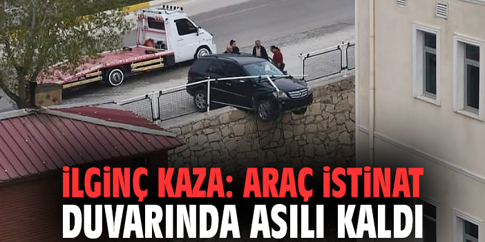İlginç kaza: Araç istinat duvarında asılı kaldı