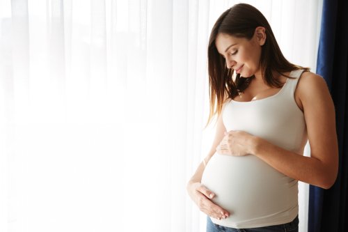 portrait-happy-pregnant-woman-touching-her-belly.jpg