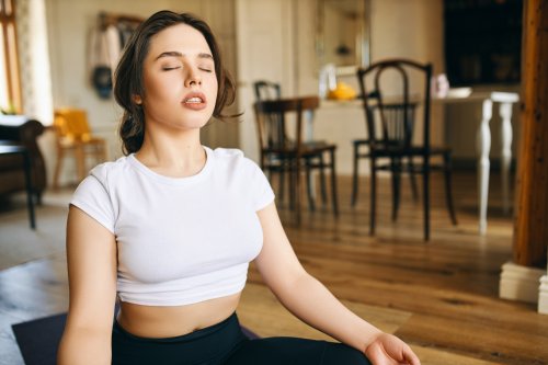 beautiful-young-caucasian-woman-with-muscular-curvy-body-sitting-lotus-posture-home-keeping-eyes-closed-meditating-during-yoga-practive-doing-body-scanning-concentrating-breathing.jpg