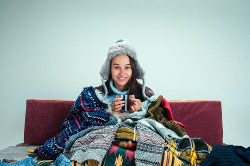 young-sick-woman-with-flue-sitting-sofa-home-studio-covered-with-knitted-warm-clothes-illness-influenza-pain-concept-relaxation-home-healthcare-concepts.jpg