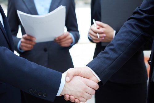 handshake-executives-greeting-each-other-1098-1366.jpg