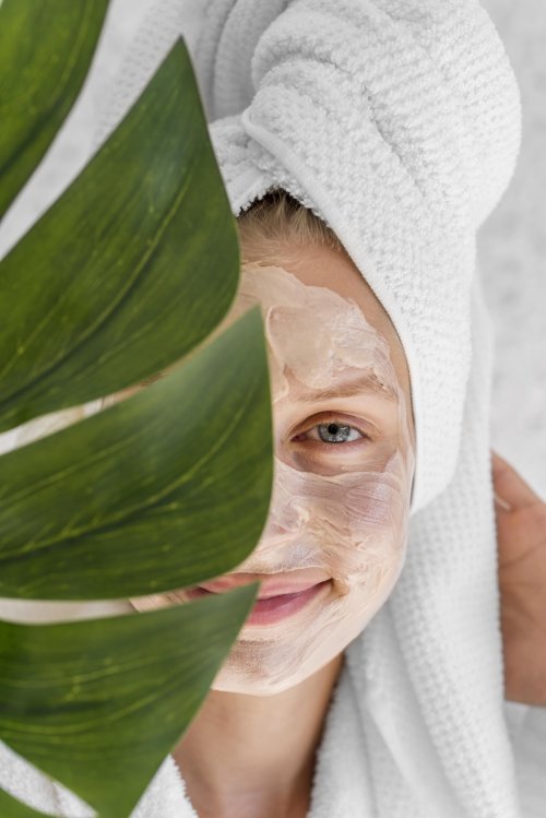 close-up-woman-holding-monstera-leaf.jpg
